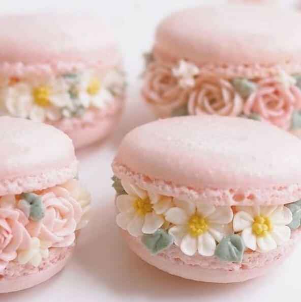 Floral Macaron - Macaroon's infused with fresh made rose syrup filled with hand piped floral frosting flowers and delicately placed sugar leaves.